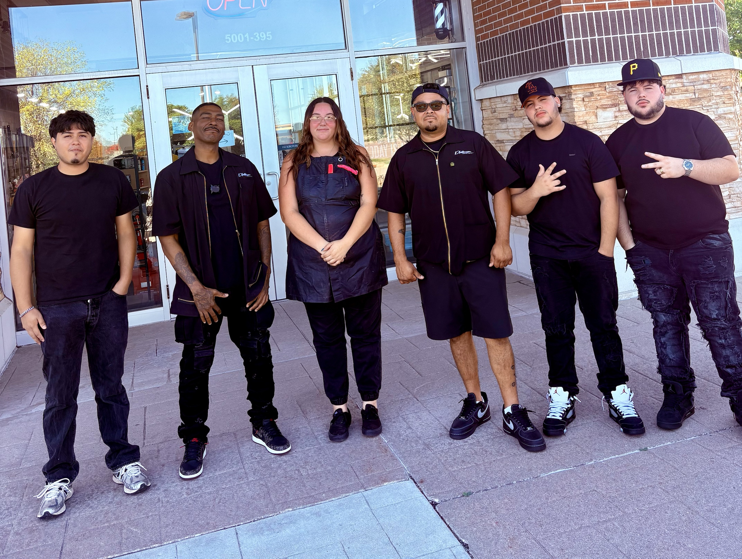 The Platinum Noir crew outside the shop